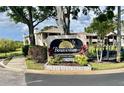 Bonaventure community sign amidst lush landscaping and mature trees at 3025 Bonaventure Cir # 103, Palm Harbor, FL 34684
