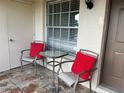 Relax on the patio with comfortable seating, perfect for outdoor enjoyment at 3025 Bonaventure Cir # 103, Palm Harbor, FL 34684