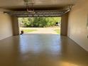 The garage has a painted floor and an automatic door opener at 3355 Abeline Rd, Spring Hill, FL 34608