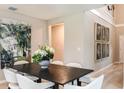 Formal dining room showcasing a large table, modern chairs and eye-catching wall art at 37213 Sagemoor Dr, Zephyrhills, FL 33541