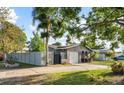 A single-story home featuring a well-kept lawn, an arched entryway, and a one-car garage at 3961 15Th N Ave, St Petersburg, FL 33713