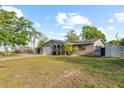 Single-story home featuring a well-kept lawn and an arched entryway with a one-car garage at 3961 15Th N Ave, St Petersburg, FL 33713