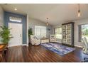 Inviting living room featuring hardwood floors, stylish furniture, and lots of natural light at 632 Lake Cypress Cir, Oldsmar, FL 34677