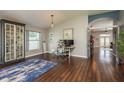 Bright living room with beautiful hardwood floors, neutral walls, and modern decor at 632 Lake Cypress Cir, Oldsmar, FL 34677