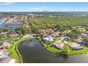 Beautiful aerial view of the property with a scenic lake and surrounding neighborhood at 7201 15Th Ne Ct, St Petersburg, FL 33702