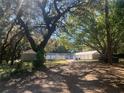 Spacious property featuring multiple storage units and mature trees at 832 S Parsons Ave, Brandon, FL 33511