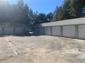 Angle view of Storage Units with garage style doors and parking area at 832 S Parsons Ave, Brandon, FL 33511