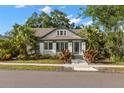 Charming single-story home with lush landscaping, mature trees, and inviting curb appeal at 115 21St Ne Ave, St Petersburg, FL 33704