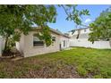Spacious backyard with a small patio and mature trees, providing a peaceful retreat at 1759 Massachusetts Ne Ave, St Petersburg, FL 33703