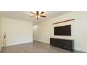 Open living room with modern flooring, contemporary ceiling fan, and natural light, perfect for relaxation at 18236 Paradise Point Dr, Tampa, FL 33647