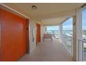 Hallway with elevator access and a bench seating area overlooking the waterfront view at 1847 Shore S Dr # 507, South Pasadena, FL 33707