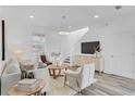 Stylish living room showcases modern décor, hardwood floors, contemporary lighting, and neutral colors at 2410 W North A St # 2, Tampa, FL 33609