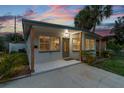 Charming home with a covered porch, updated tile and fresh exterior paint at 3066 Highland N St, St Petersburg, FL 33704