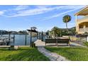 Dockside seating with a lift for a boat, as well as landscaping and access to a beautiful waterway at 3918 Versailles Dr, Tampa, FL 33634