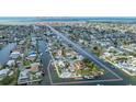 Wide aerial shot showing the home's location on a canal leading to the Gulf of Mexico at 4290 Carlos Ct, Hernando Beach, FL 34607