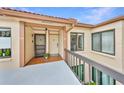 Inviting front entrance of condo unit with private entry way, tiled floor and charming accents at 6269 Palma Del Mar S Blvd # 206, St Petersburg, FL 33715