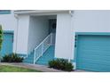 Close up view of the entrance to condos with a staircase and attached garage at 6618 Pineview Ter # 6618, Bradenton, FL 34203