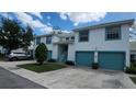 Well-maintained condo building with two-car garages and attractive landscaping at 6618 Pineview Ter # 6618, Bradenton, FL 34203