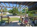 Inviting covered porch with string lights offers a relaxing outdoor seating area at 2132 40Th N Ave, St Petersburg, FL 33714
