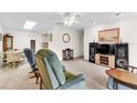 Spacious living room with classic furnishings, a large entertainment center, and a cozy ambiance at 2241 Shelly Dr # D, Palm Harbor, FL 34684