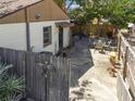 Backyard featuring an outdoor dining area and a fenced yard offering privacy and space for relaxation at 251 72Nd Ave, St Pete Beach, FL 33706