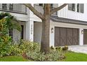 Beautiful house number detail with an immaculate front lawn and a three-car garage at 3406 W Alline Ave, Tampa, FL 33611