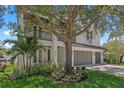 Beautiful modern farmhouse with a three-car garage and well-manicured landscaping at 3406 W Alline Ave, Tampa, FL 33611