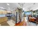 Open-concept kitchen and living space with hardwood floors, stainless steel appliances, and modern design elements at 345 Bayshore Blvd # Gp10, Tampa, FL 33606