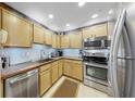 Bright kitchen features modern stainless steel appliances, light wooden cabinets, and warm countertops at 345 Bayshore Blvd # Gp10, Tampa, FL 33606