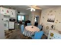 Cozy dining area adjacent to the kitchen, ideal for casual meals and gatherings, with access to living spaces at 3829 Chah Dr, Zephyrhills, FL 33541