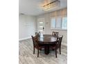 Dining room features new hardwood flooring and a modern light fixture at 428 45Th N Ave, St Petersburg, FL 33703