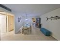 Cozy dining area with a modern table set, unique lighting, and stylish decorations for memorable gatherings at 5155 9Th N Ave # 102, St Petersburg, FL 33710