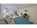 Charming living area boasts comfortable seating, bright lighting, and unique coastal decor for a relaxed feel at 5155 9Th N Ave # 102, St Petersburg, FL 33710