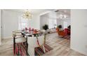 Open dining room with bright lighting and view into sitting area at 559 Scotland St, Dunedin, FL 34698