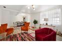Bright living room with stylish furniture, light wood floors and lots of natural light at 559 Scotland St, Dunedin, FL 34698