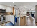 Modern kitchen with stainless steel appliances, granite countertops, and an open layout at 6277 Bahia Del Mar Blvd # 110, St Petersburg, FL 33715