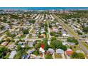 An aerial shot showcasing the property within a lovely neighborhood close to the coast and other local amenities at 10074 Bahama Ct, Seminole, FL 33776