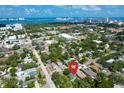 An aerial view highlighting the property's location with city and water views in the background at 1107 S Prospect Ave, Clearwater, FL 33756
