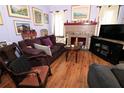 Cozy living room with a brick fireplace and a comfortable sofa, perfect for relaxation at 1107 S Prospect Ave, Clearwater, FL 33756