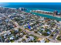 A vibrant coastal neighborhood with houses, palm trees, and stunning ocean views at 500 79Th Ave, St Pete Beach, FL 33706