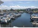 Picturesque aerial view of the marina, showing numerous boats and waterfront homes at 5712 Biscayne Ct # 203, New Port Richey, FL 34652