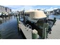 View of boat lift along the water, offering convenient boat storage and access at 5712 Biscayne Ct # 203, New Port Richey, FL 34652