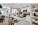 Bright kitchen with stainless steel appliances and a marble countertop island with barstool seating at 100 4Th S Ave # 132, St Petersburg, FL 33701