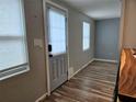 Entryway featuring neutral wall paint, tile floors, and a stylish exterior door with blinds at 126 119Th Ave, Treasure Island, FL 33706
