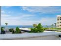 Breathtaking ocean view from the balcony showcases blue waters and serene greenery at 1460 Gulf Blvd # 108, Clearwater, FL 33767
