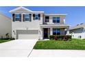 Charming two-story home with a two-car garage and a well-maintained lawn at 2933 Maiden Grass Isle, Wesley Chapel, FL 33543