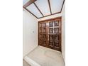 Elegant double door entry with decorative carvings and transom window overhead at 3021 Countryside Blvd # 45A, Clearwater, FL 33761