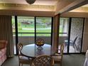 Cozy dining area with glass table and outdoor views at 36750 Us 19 N # 4-205, Palm Harbor, FL 34684