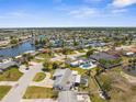 Expansive aerial view of a waterfront community featuring numerous canals and residential homes at 4210 Headsail Dr, New Port Richey, FL 34652