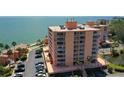 Exterior shot highlighting balconies, lush landscaping, and parking at this waterfront condo community at 7432 Sunshine Skyway S Ln # 406, St Petersburg, FL 33711